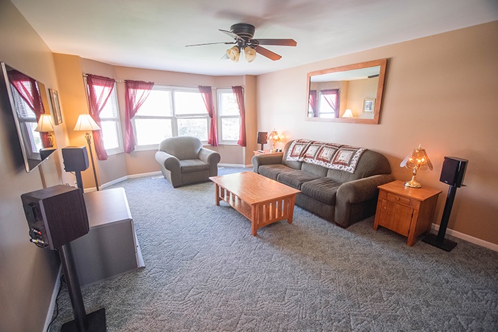 110 Pembroke Road Southwest Poplar Grove, IL 61065 - Photo 2 of 25 a living room with furniture and a large window