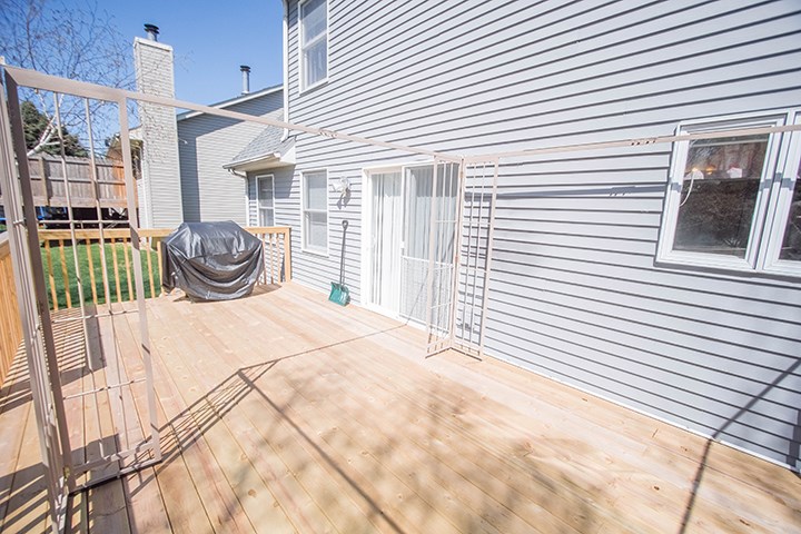 110 Pembroke Road Southwest Poplar Grove, IL 61065 - Photo 21 of 25 a white and red house with a outdoor space