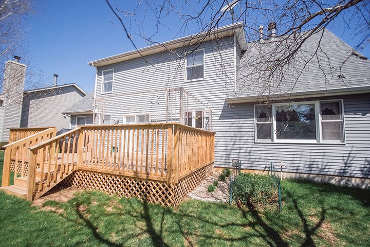 110 Pembroke Road Southwest Poplar Grove, IL 61065 - Photo 23 of 25 a front view of a house with a garden