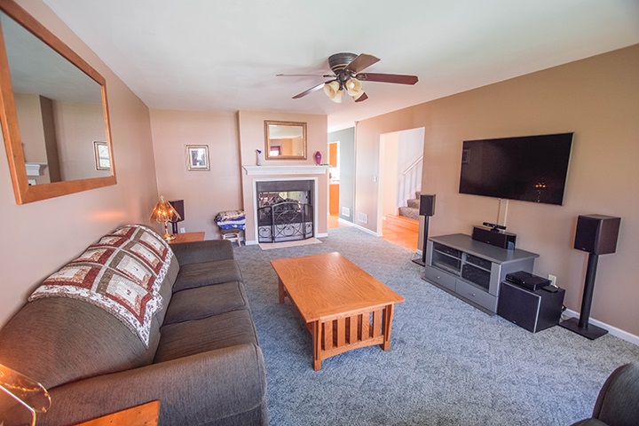 110 Pembroke Road Southwest Poplar Grove, IL 61065 - Photo 3 of 25 a living room with furniture and a flat screen tv