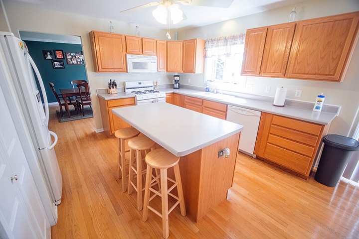 110 Pembroke Road Southwest Poplar Grove, IL 61065 - Photo 5 of 25 a kitchen with stainless steel appliances a sink a counter top space and a window