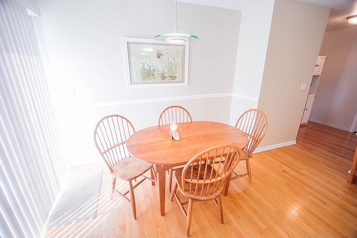 110 Pembroke Road Southwest Poplar Grove, IL 61065 - Photo 6 of 25 a view of a dining room with furniture and wooden floor