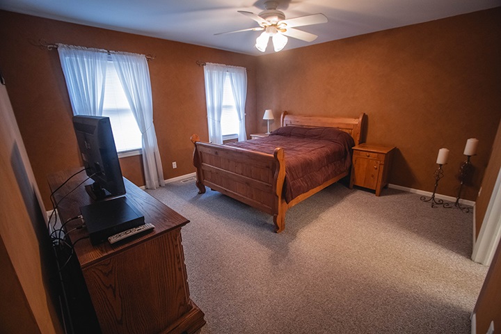 110 Pembroke Road Southwest Poplar Grove, IL 61065 - Photo 8 of 25 a bedroom with a bed and a window
