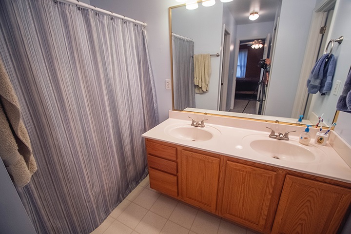 110 Pembroke Road Southwest Poplar Grove, IL 61065 - Photo 10 of 25 a bathroom with a double vanity sink and a mirror