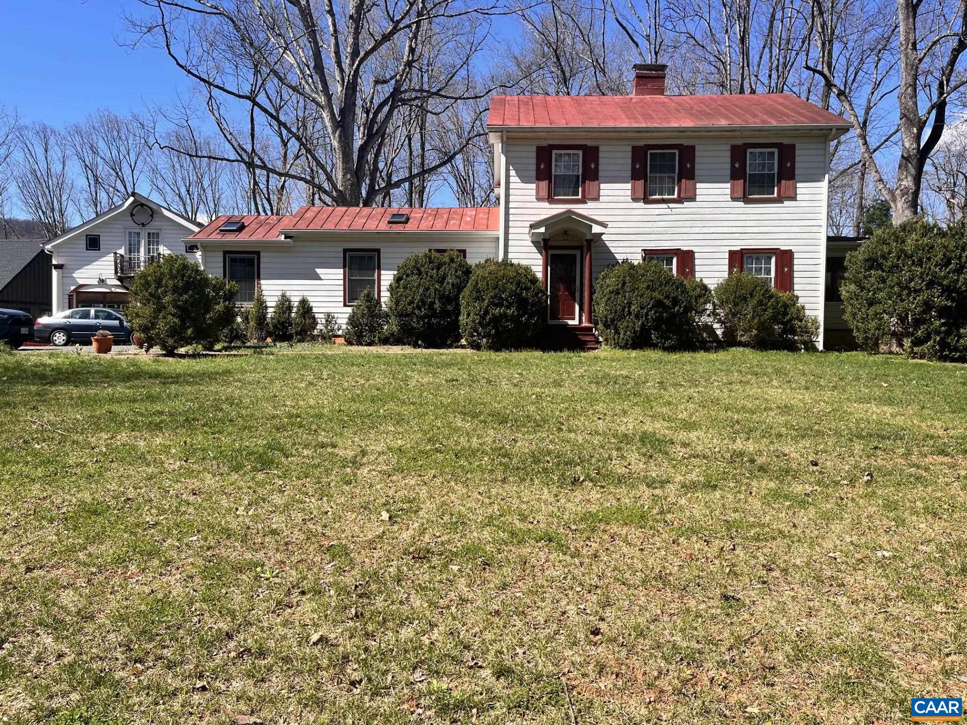954 Old Lynchburg Road, Unit A Charlottesville, VA 22903 - Photo 1 of 44 a front view of a building with a yard