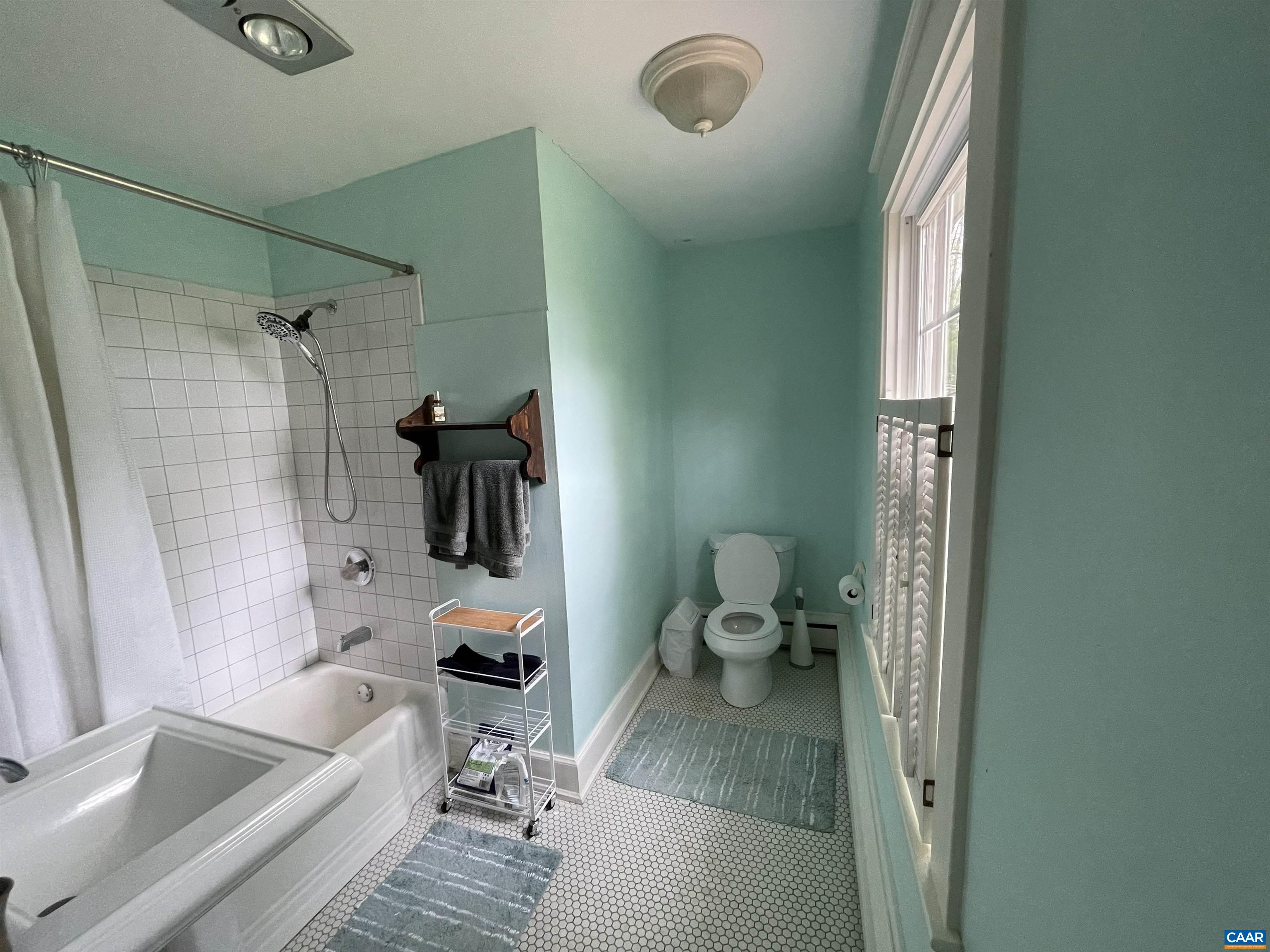 954 Old Lynchburg Road, Unit A Charlottesville, VA 22903 - Photo 15 of 44 a bathroom with a tub and a toilet