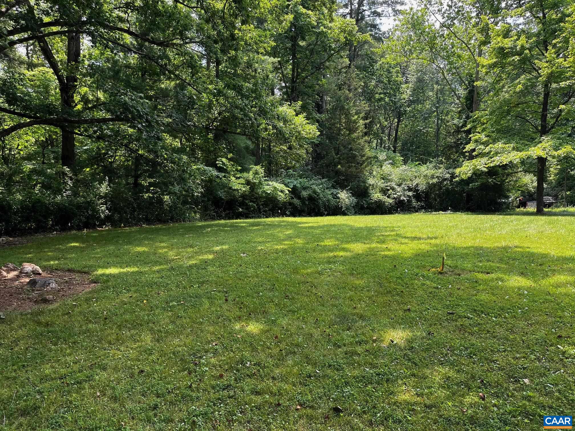 954 Old Lynchburg Road, Unit A Charlottesville, VA 22903 - Photo 3 of 44 a view of a field with trees in the background