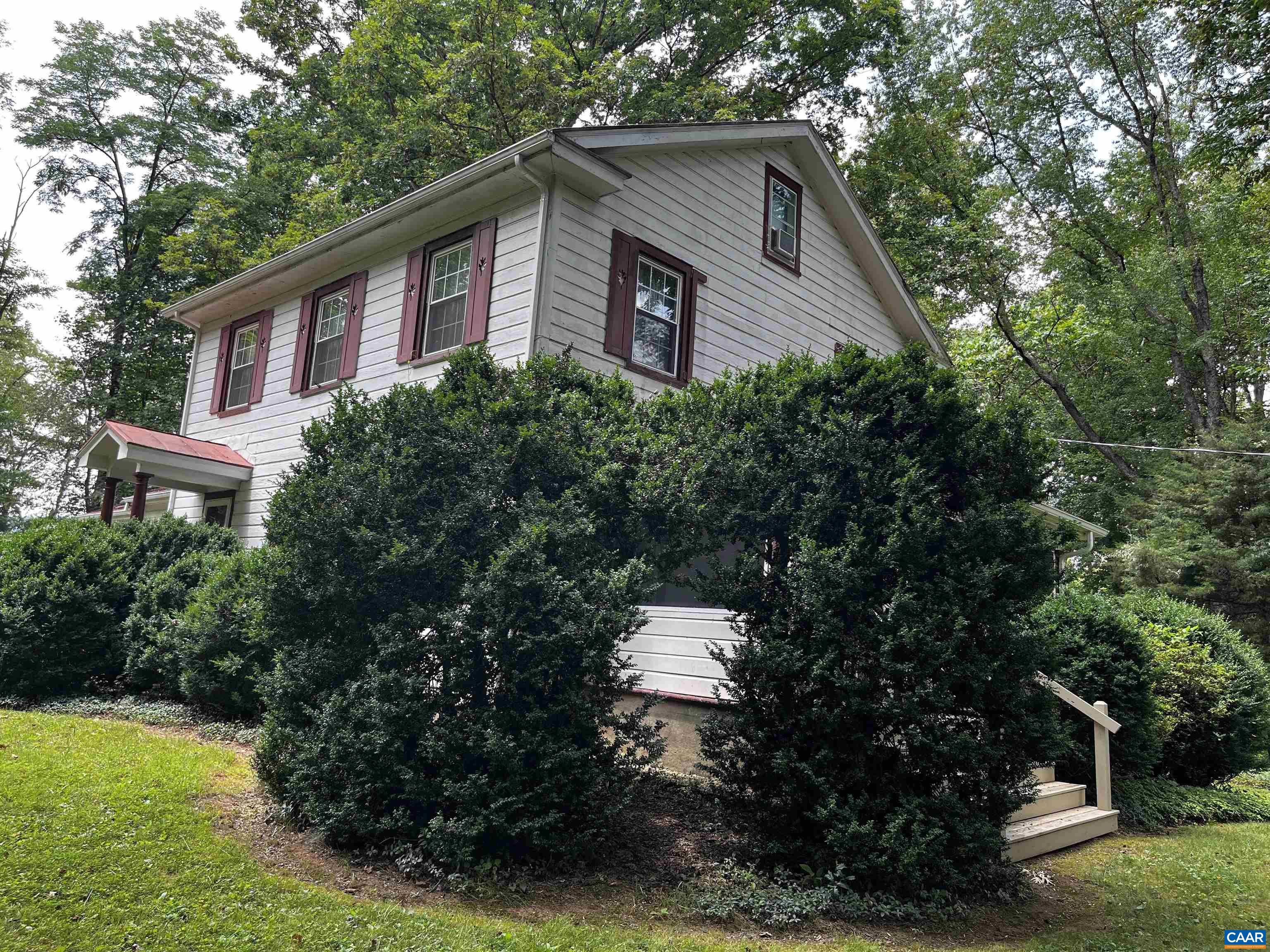 954 Old Lynchburg Road, Unit A Charlottesville, VA 22903 - Photo 40 of 44 a front view of a house with a yard