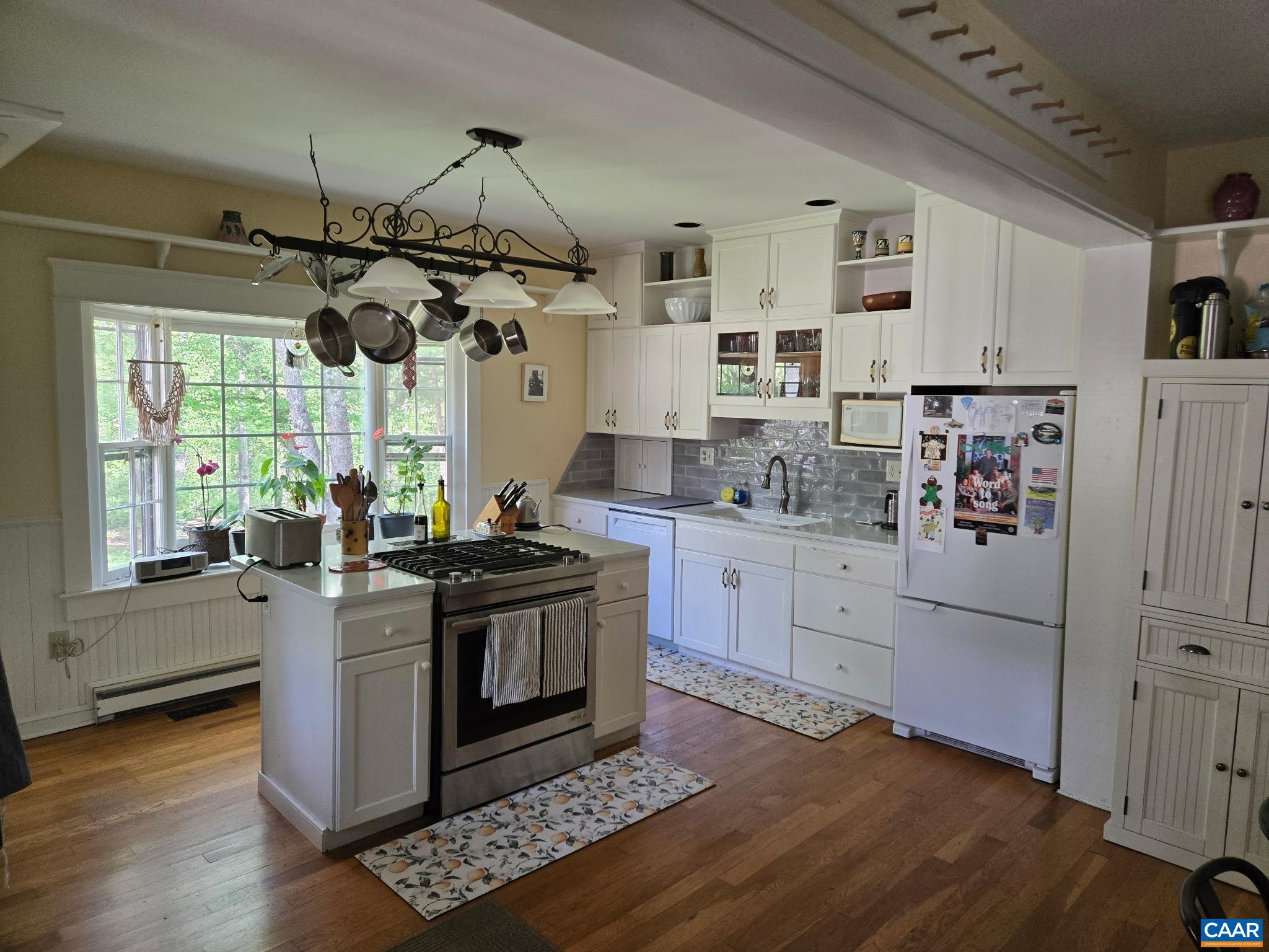 954 Old Lynchburg Road, Unit A Charlottesville, VA 22903 - Photo 4 of 44 a kitchen with stainless steel appliances granite countertop a stove and a refrigerator