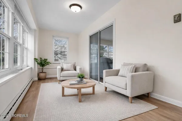 a living room with furniture and a large window