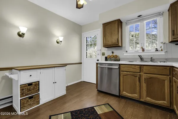 a kitchen with stainless steel appliances a sink stove and cabinets