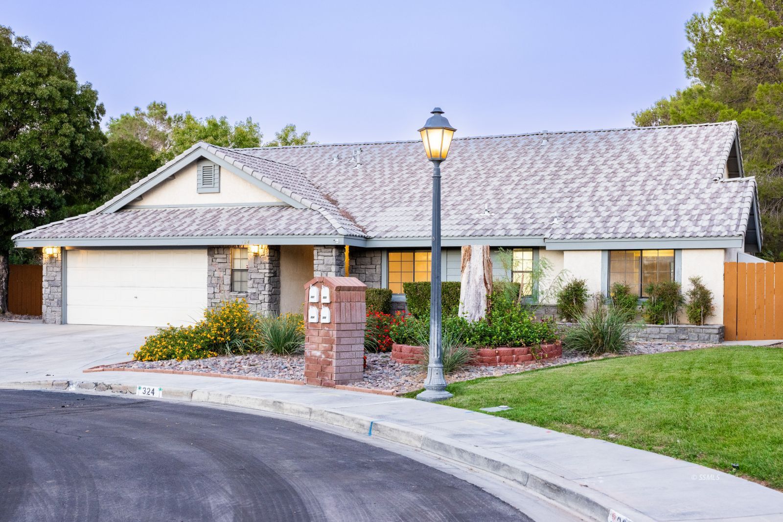 324 West Pilgrim Court Ridgecrest, CA 93555 - Photo 2 of 37 a front view of a house with garden
