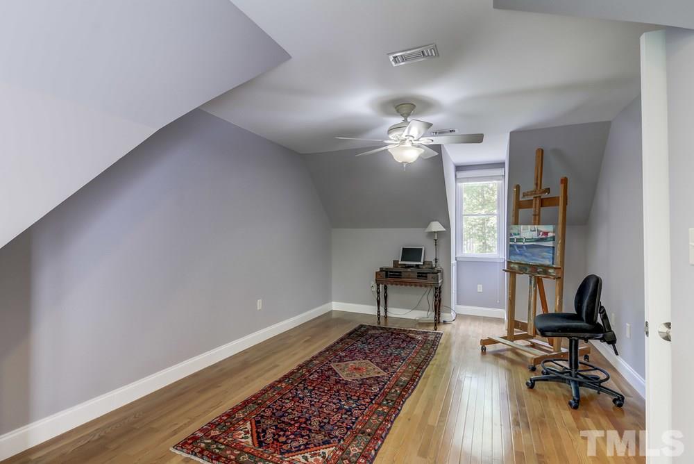 5612 Purnell Road Wake Forest, NC 27587 - Photo 14 of 23 a view of a workspace with furniture and a livingroom