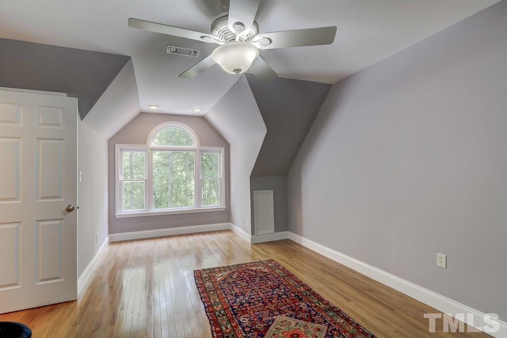 5612 Purnell Road Wake Forest, NC 27587 - Photo 15 of 23 wooden floor in an empty room with a window