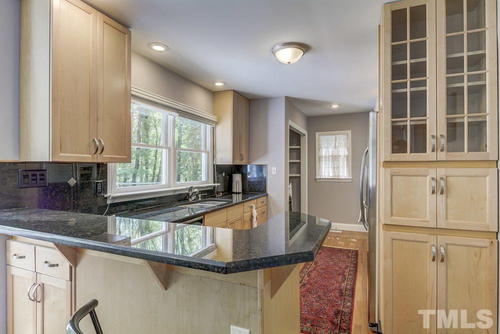 5612 Purnell Road Wake Forest, NC 27587 - Photo 5 of 23 a kitchen with granite countertop a sink and a window