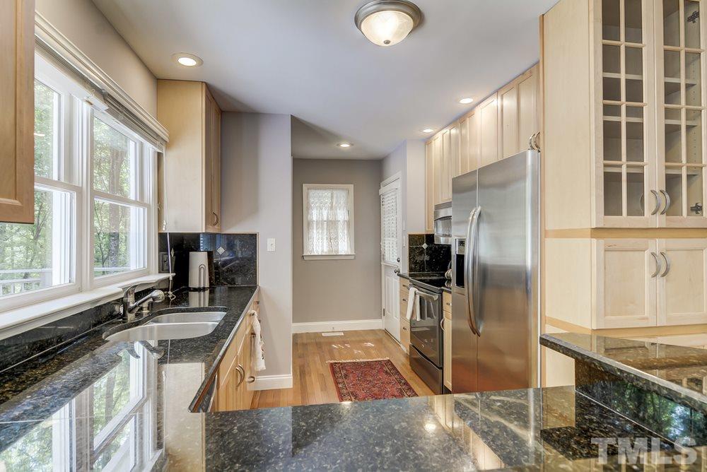 5612 Purnell Road Wake Forest, NC 27587 - Photo 6 of 23 a kitchen with a sink stove and refrigerator