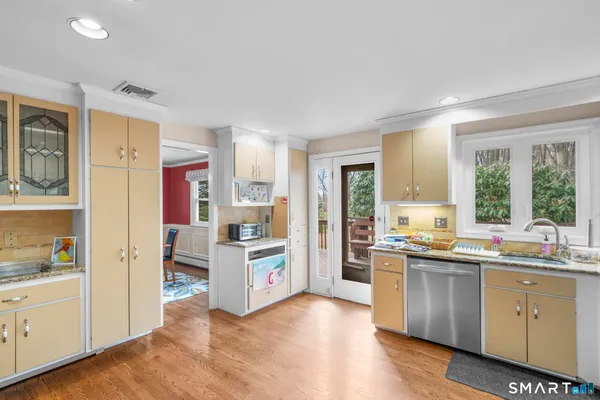 a kitchen with a sink stove and refrigerator