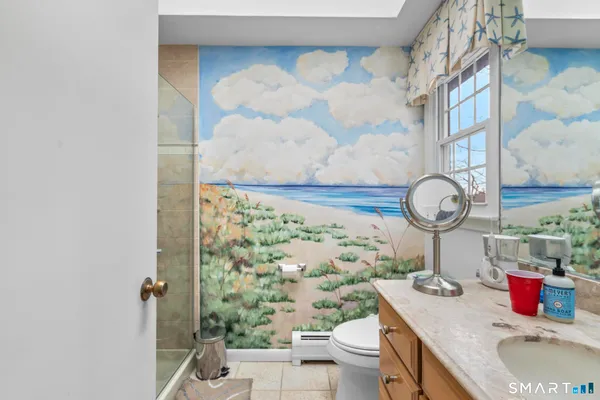 a bathroom with a toilet and a sink