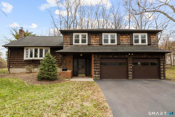 a front view of a house with a yard
