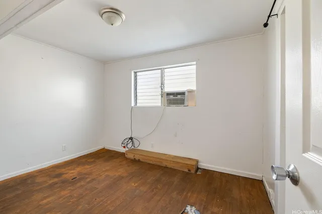 a view of a room with wooden floor