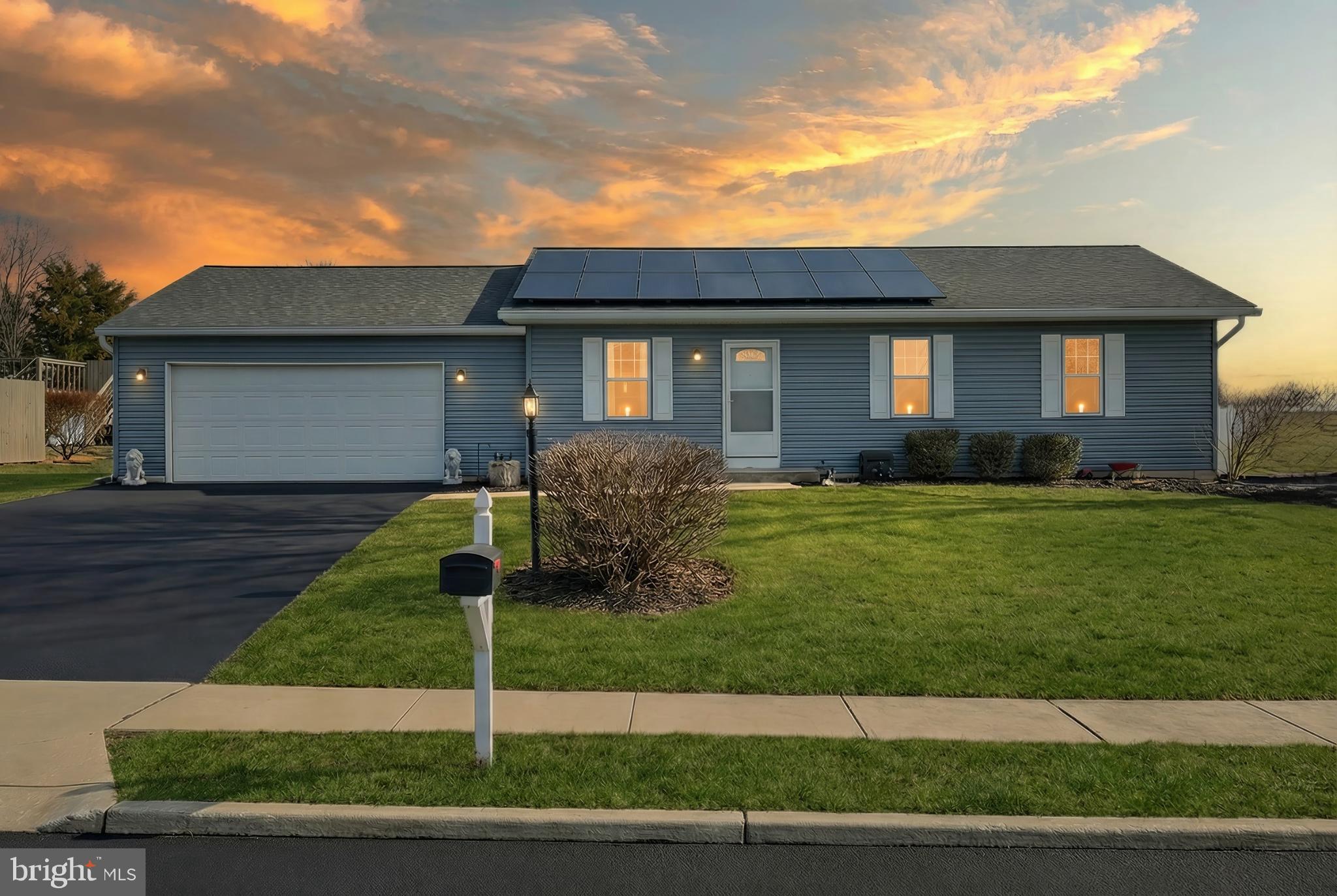 2508 Manor Road York, PA 17408 - Photo 1 of 39 New grey vinyl siding with solar panels at sunset