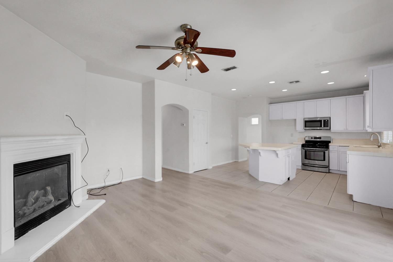 1412 Red Ribbons Lane Manteca, CA 95337 - Photo 10 of 32 a view of kitchen with cabinets and wooden floor