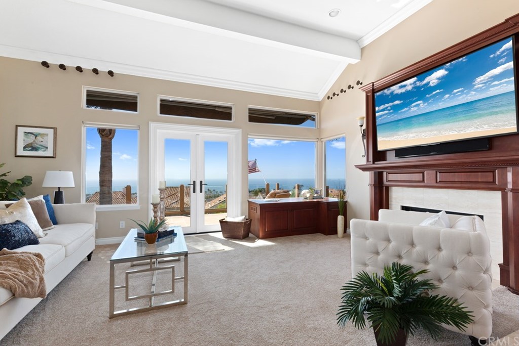 17 St Francis Court Dana Point, CA 92629 - Photo 16 of 66 a living room with furniture fireplace and a flat screen tv