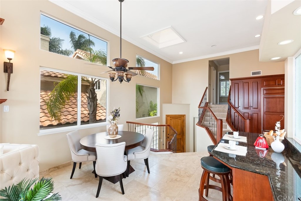 17 St Francis Court Dana Point, CA 92629 - Photo 25 of 66 a dining room with furniture a chandelier and window