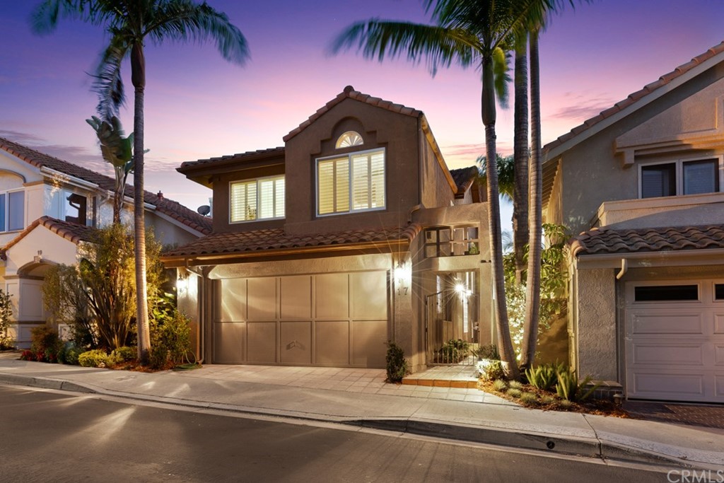 17 St Francis Court Dana Point, CA 92629 - Photo 3 of 66 a front view of a building with palm trees