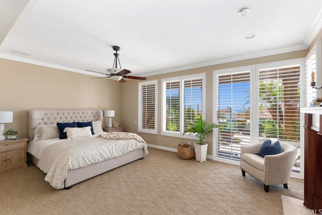 17 St Francis Court Dana Point, CA 92629 - Photo 34 of 66 a spacious bedroom with a bed and glass window