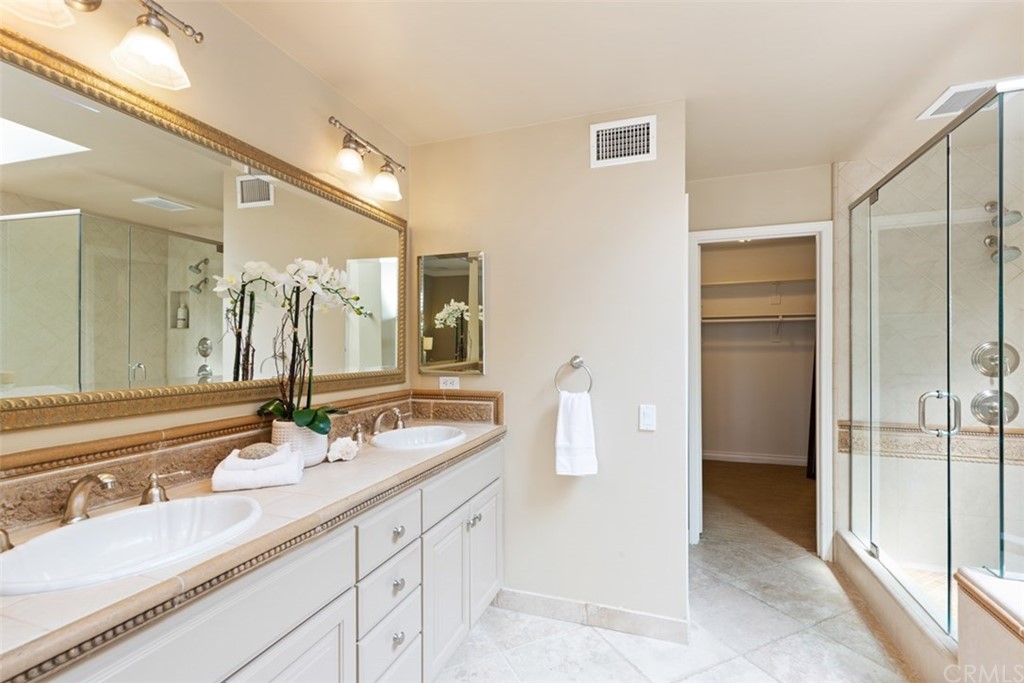 17 St Francis Court Dana Point, CA 92629 - Photo 35 of 66 a bathroom with a sink and a mirror