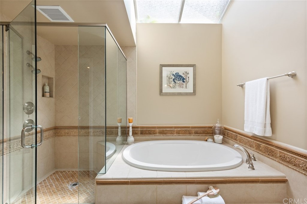 17 St Francis Court Dana Point, CA 92629 - Photo 37 of 66 a bathroom with a bathtub and shower