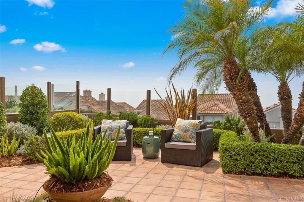 17 St Francis Court Dana Point, CA 92629 - Photo 58 of 66 a view of a chairs in patio with swimming pool