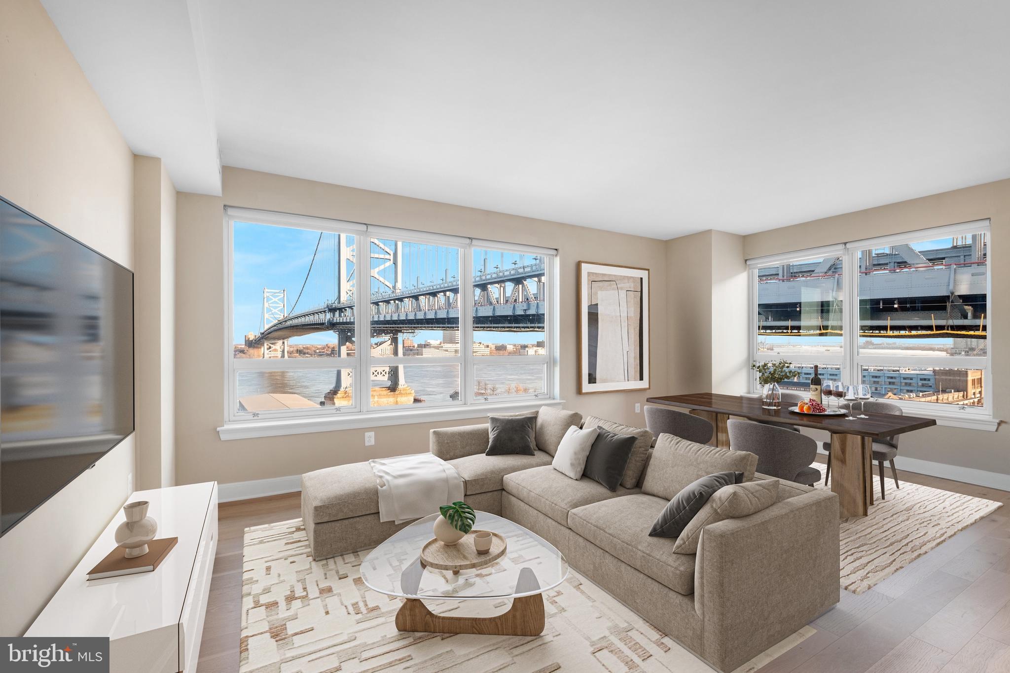 235 North Christopher Columbus Boulevard, Unit 305 Philadelphia, PA 19106 - Photo 1 of 55 a living room with furniture and a large window