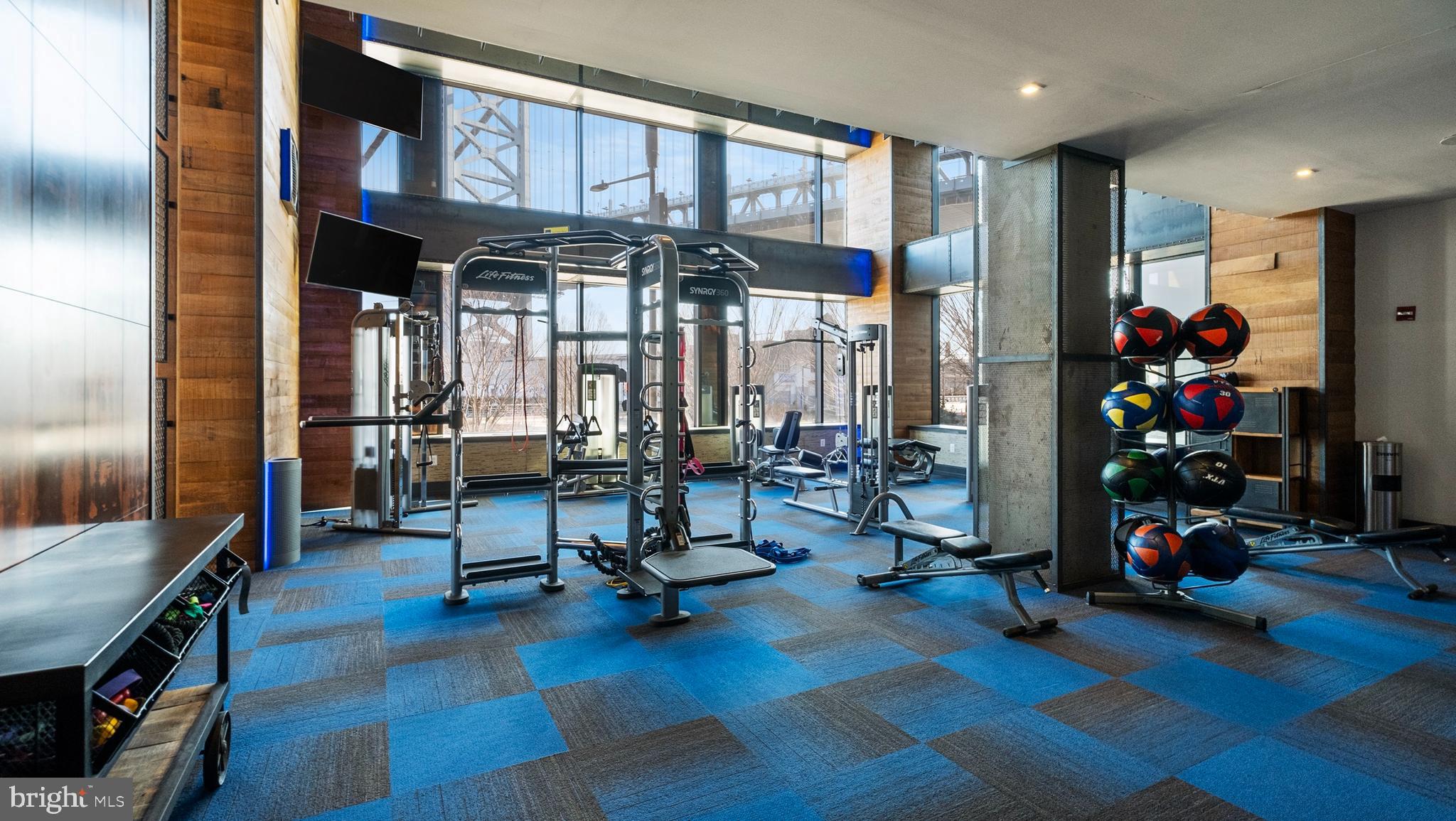 235 North Christopher Columbus Boulevard, Unit 305 Philadelphia, PA 19106 - Photo 41 of 55 a view of a room with gym equipment