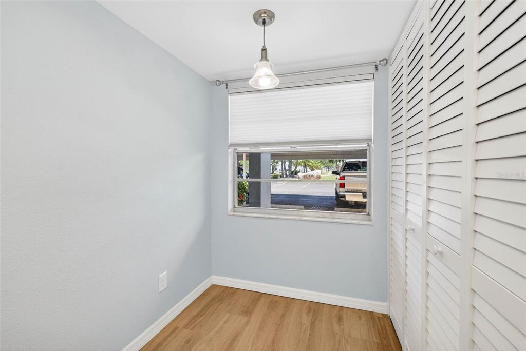 5197 Silent Loop, Unit 124 New Port Richey, FL 34652 - Photo 13 of 55 wooden floor in an empty room
