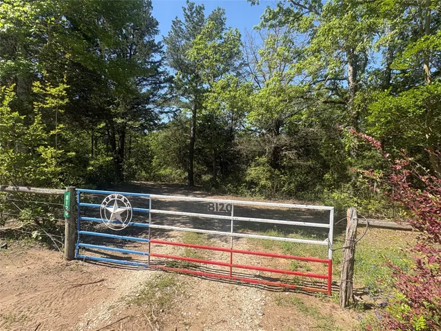 a view of a chairs and table on the wooden deck