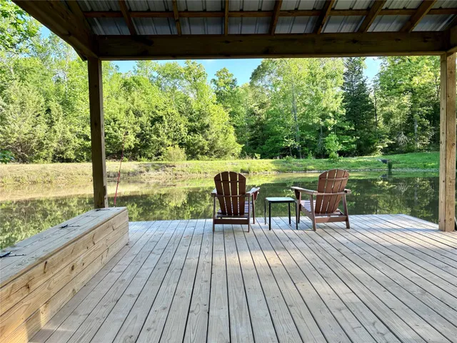 a view of a outdoor space with a house and tree