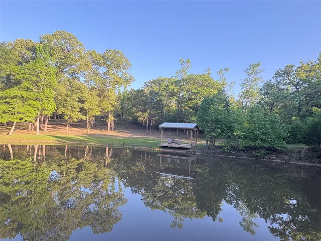 a view of a lake with sitting area