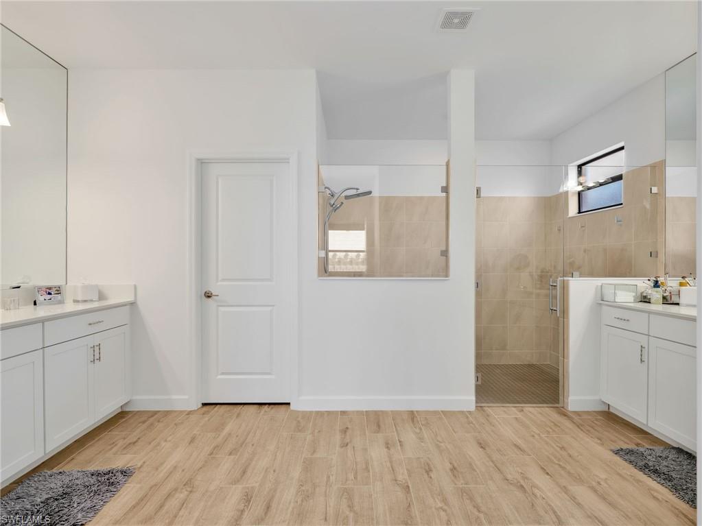 18278 Ridgeline Drive Estero, FL 33928 - Photo 18 of 45 a bathroom with a sink and a mirror