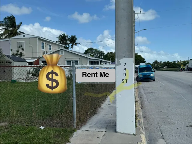 a view of a street with a building in the background