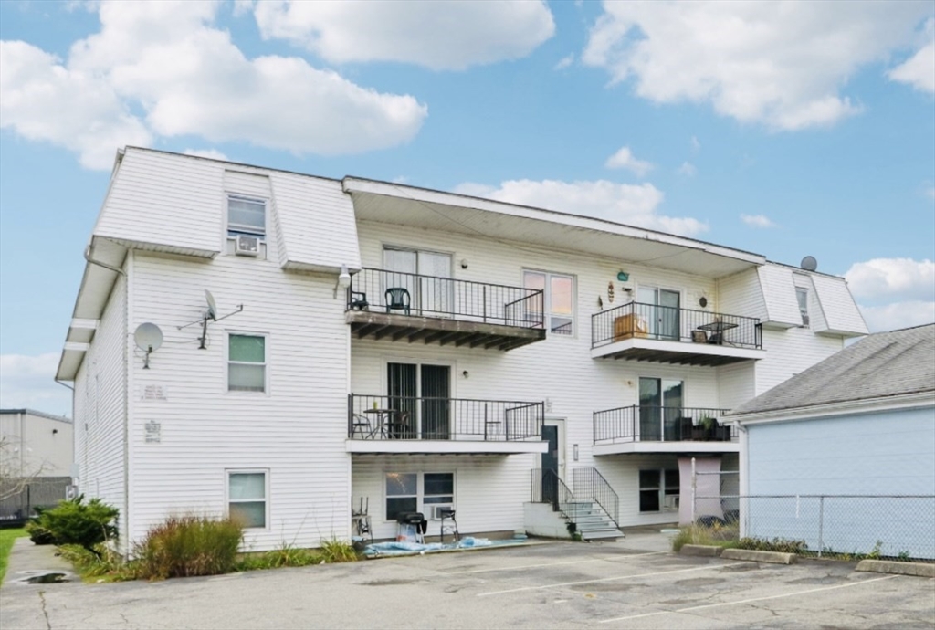 352 Vale Street, Unit 1 Fall River, MA 02724 - Photo 1 of 12 a front view of a house with a road