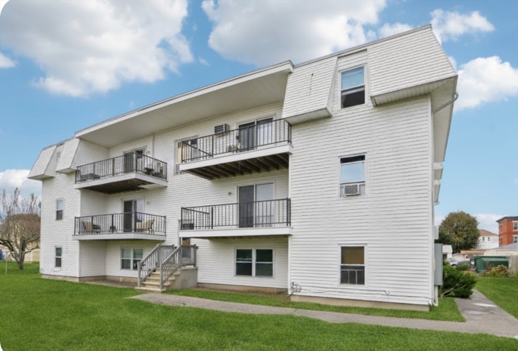 352 Vale Street, Unit 1 Fall River, MA 02724 - Photo 11 of 12 a view of a house with a yard