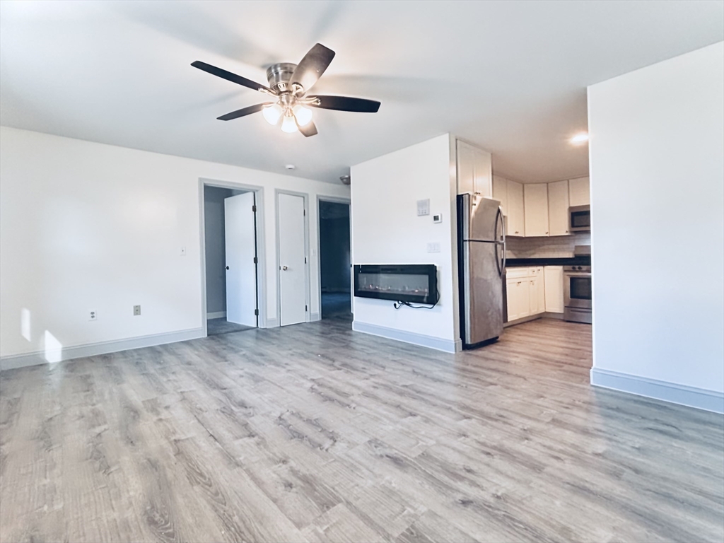 352 Vale Street, Unit 1 Fall River, MA 02724 - Photo 2 of 10 a view of a kitchen with a sink and a stove top oven