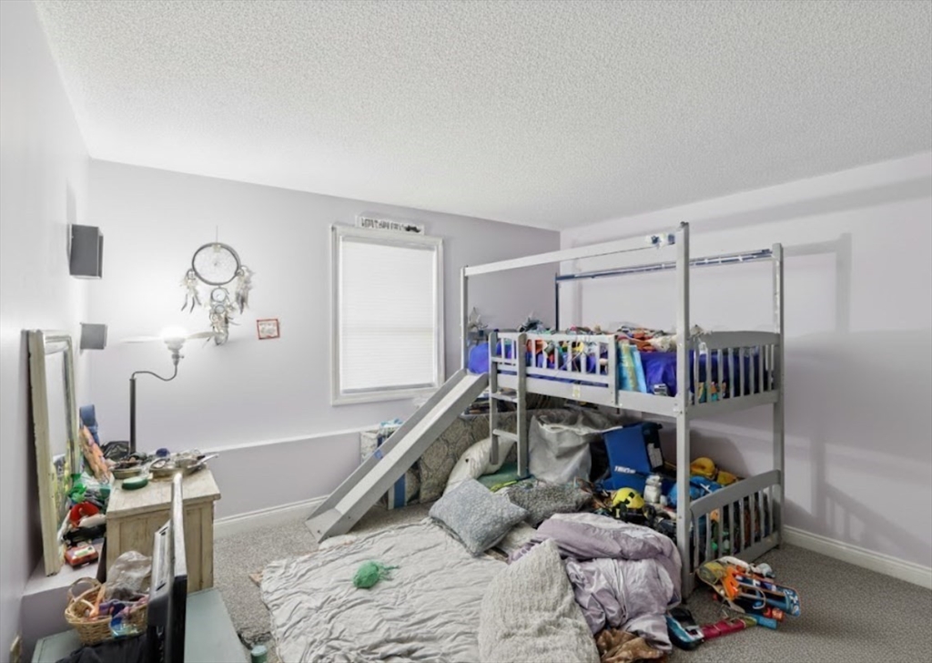 352 Vale Street, Unit 1 Fall River, MA 02724 - Photo 8 of 12 a bedroom with furniture and a closet