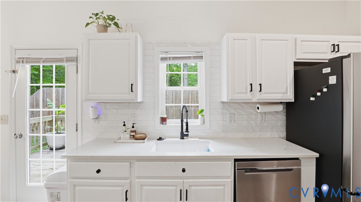 2406 Emanuel Church Road Powhatan, VA 23139 - Photo 14 of 48 Bright kitchen featuring white cabinetry, a single