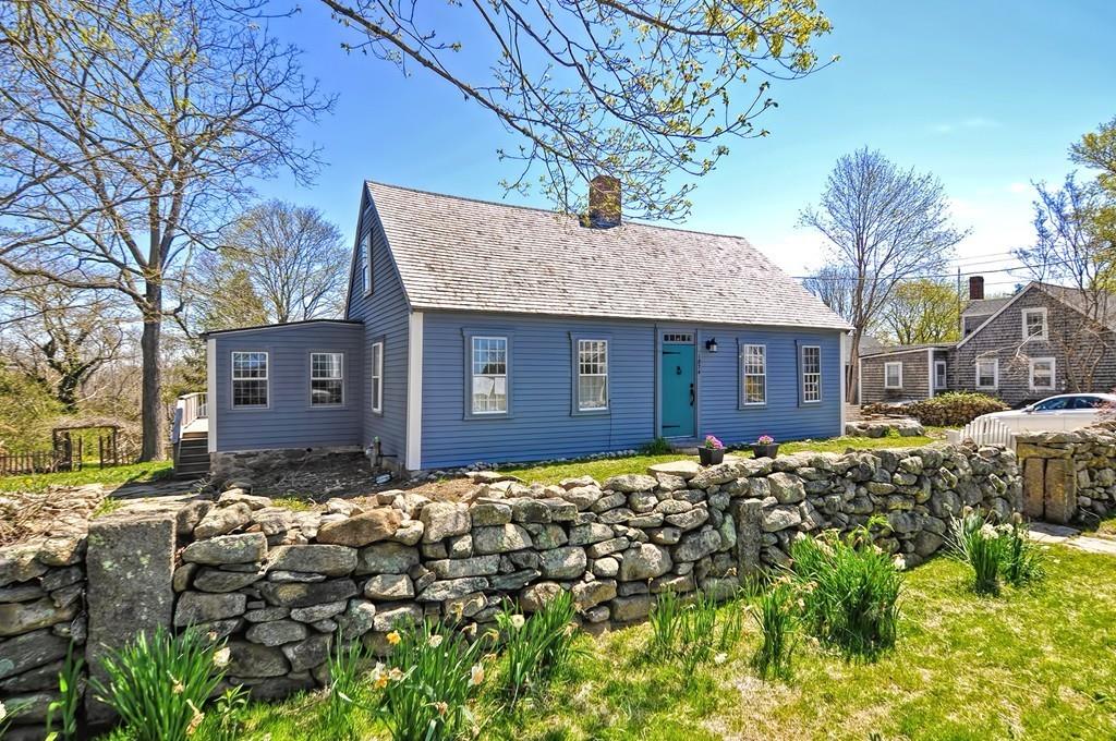 1874 Main Road Westport, MA 02791 - Photo 1 of 28 a brick house with a large tree in front of it