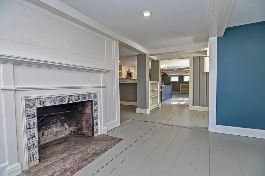 1874 Main Road Westport, MA 02791 - Photo 13 of 28 a living room with a fireplace