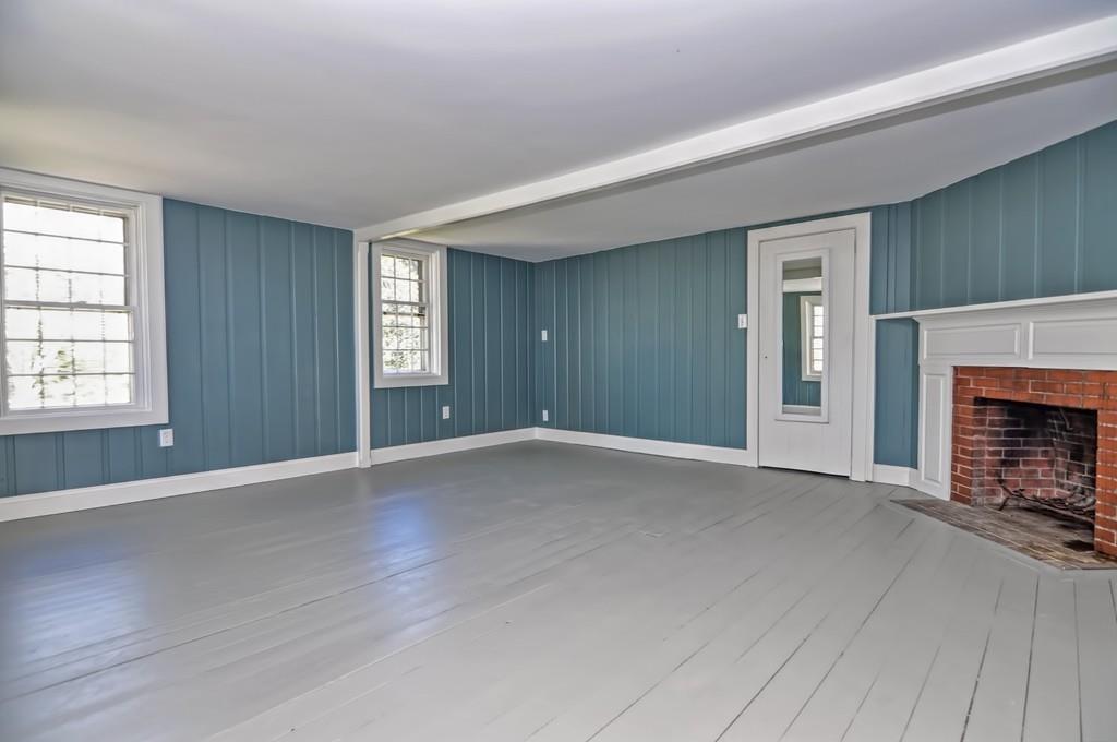 1874 Main Road Westport, MA 02791 - Photo 19 of 28 an empty room with windows and fireplace