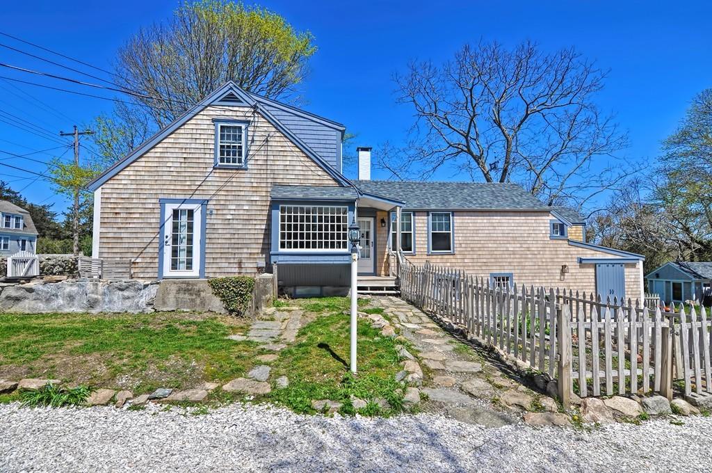 1874 Main Road Westport, MA 02791 - Photo 2 of 28 a backyard of a house with table and chairs